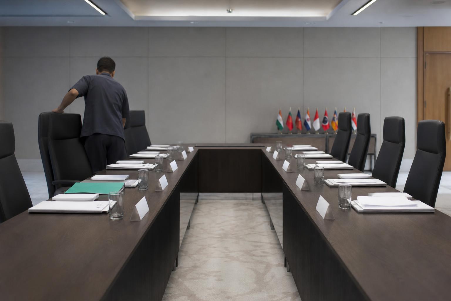 Delegation chairs sit empty before a BRICS climate finance meeting in New Delhi.