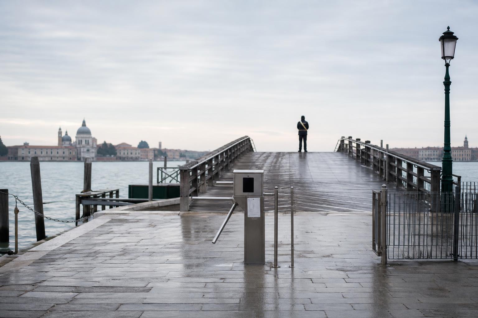 A turnstile checkpoint for day-visitor fees stands empty at dawn.