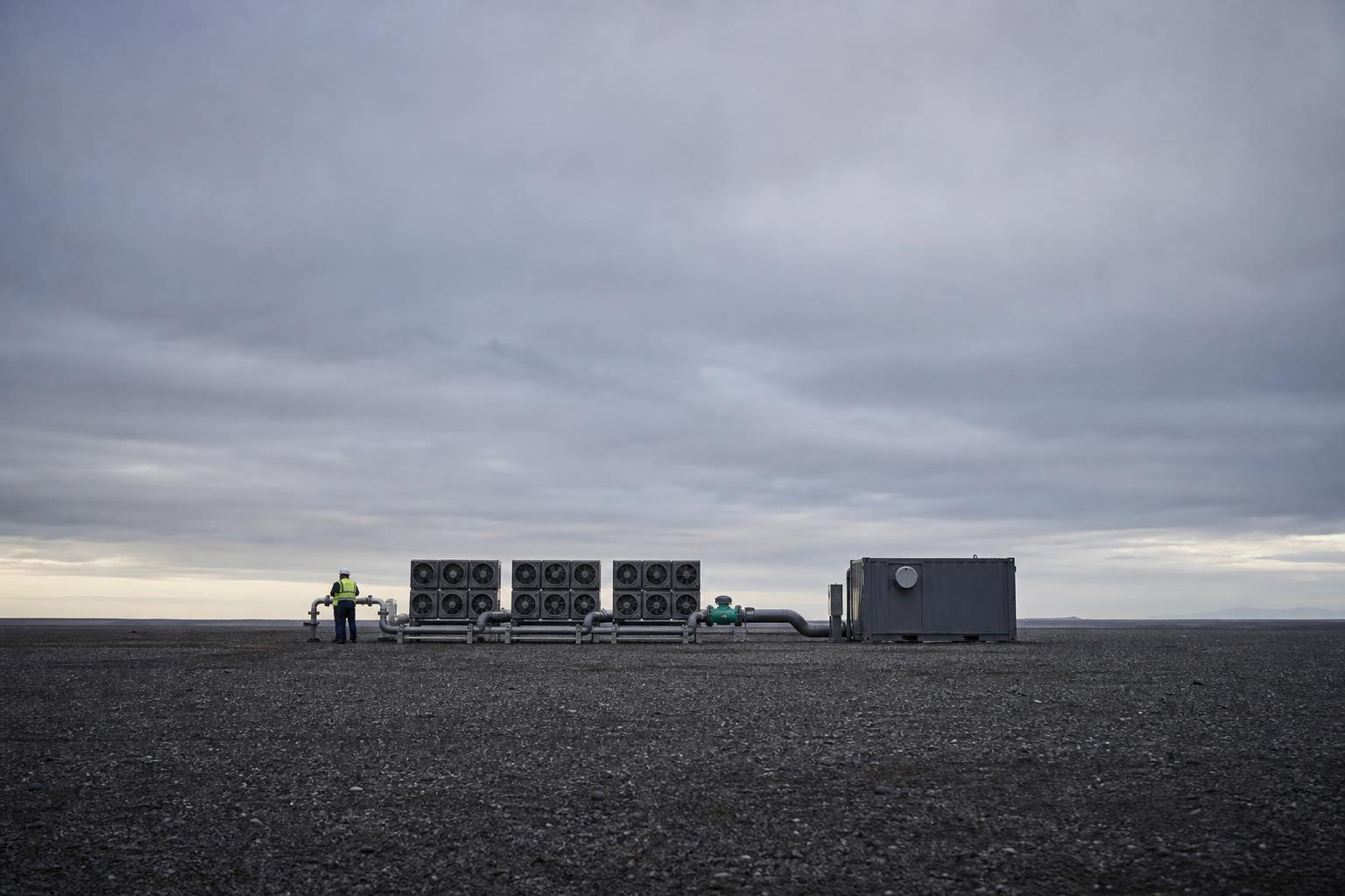 A demonstration-scale carbon capture unit, dwarfed by the emissions gap it cannot yet close.